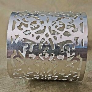 BRACELET, SILVER TONE METAL WITH CUT OUT DESIGNS,  6 ⅜ x 2 ½ INCHES, TAG ON,